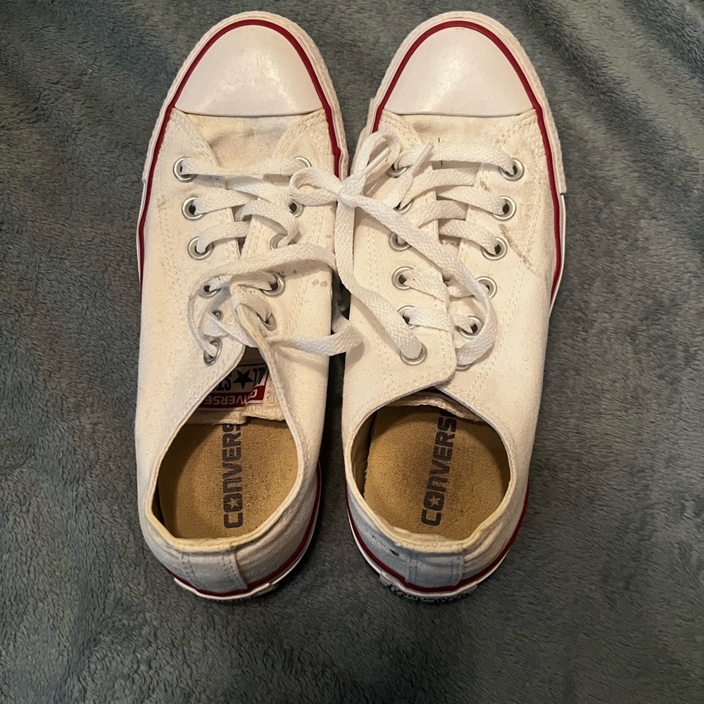 One red pair, one white pair of converse